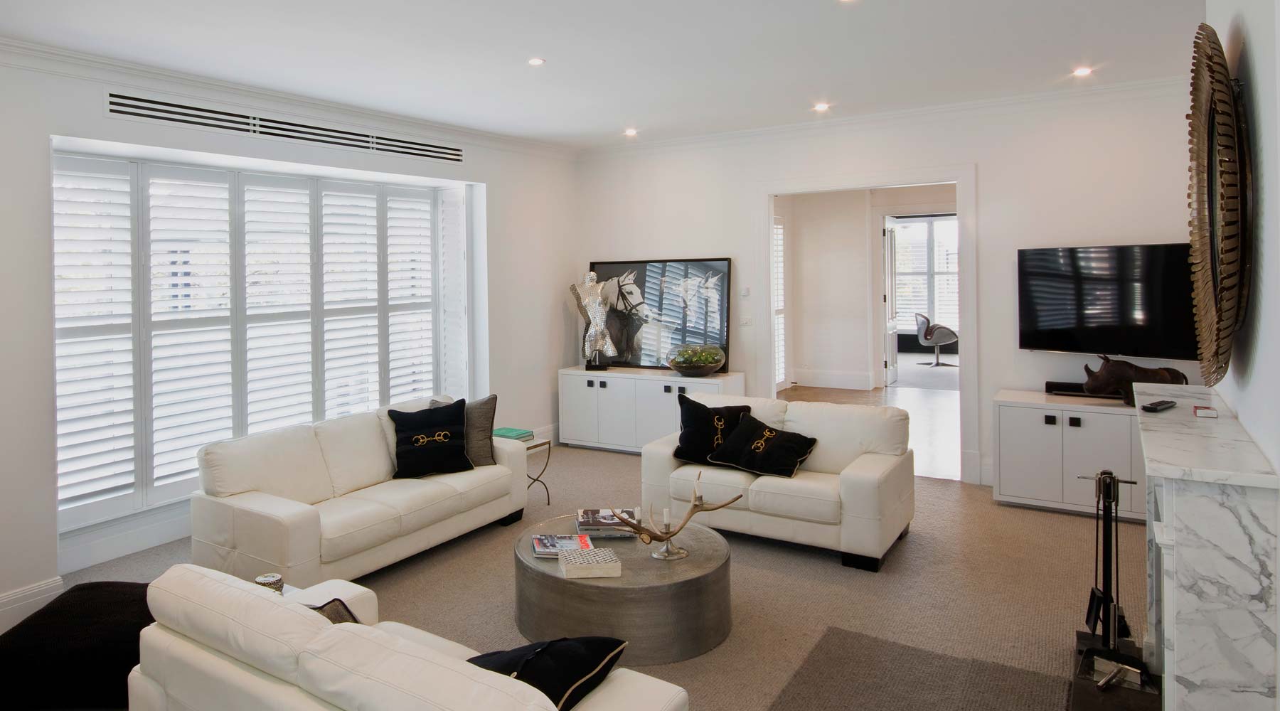 Living room warmed by a hydronic panel radiator