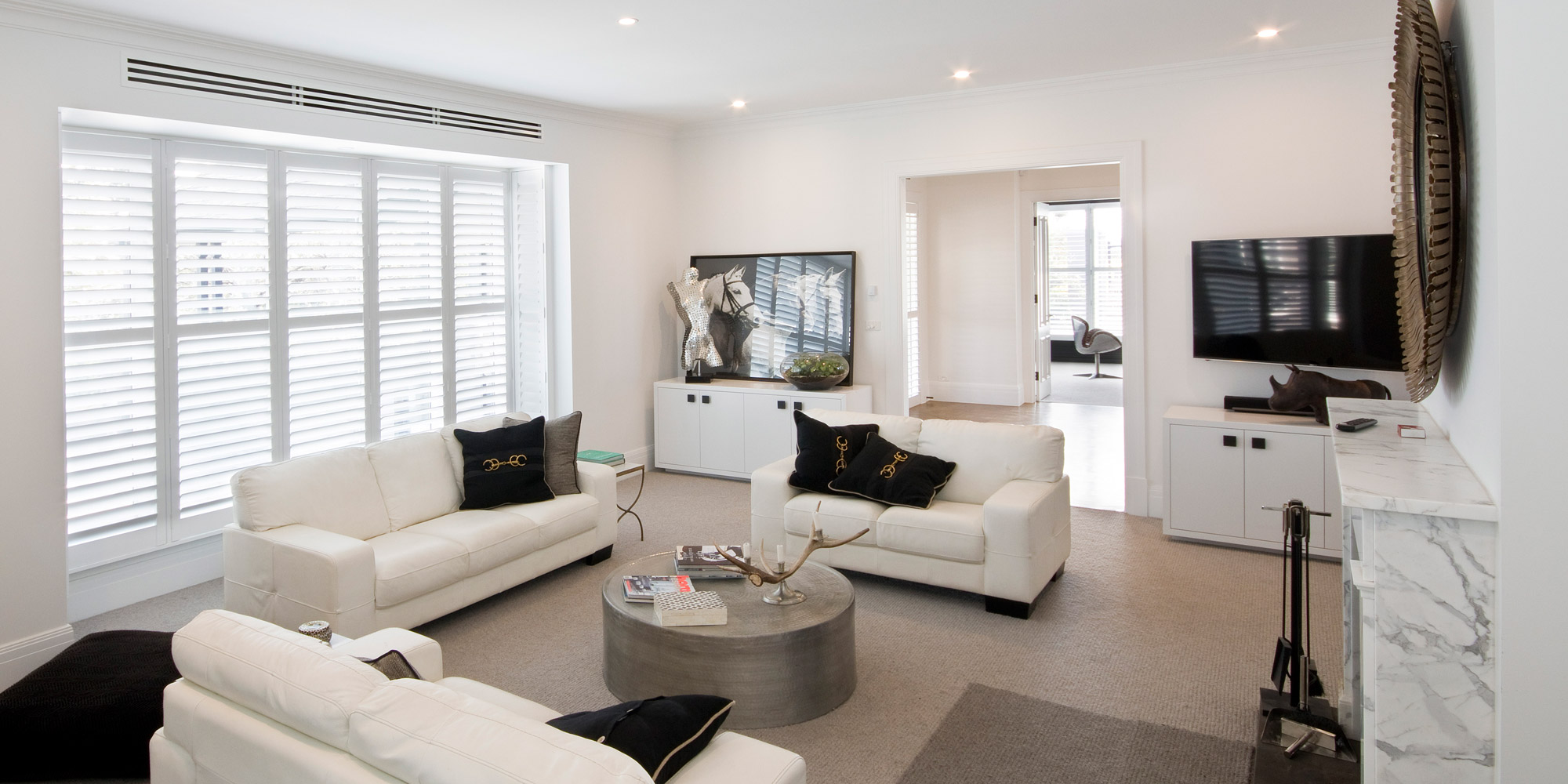 Linear slot diffusers in a Melbourne living room