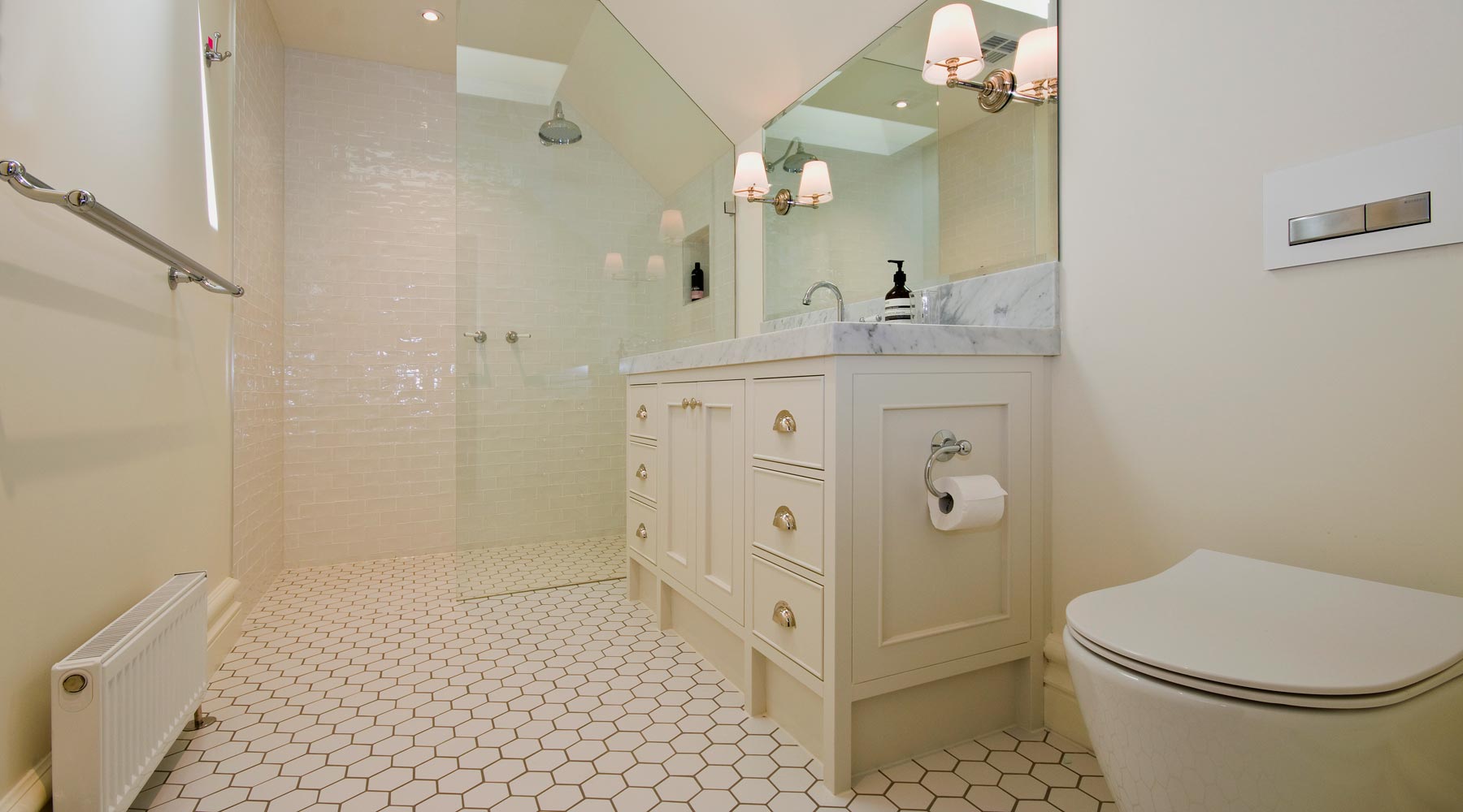 Bathroom in Callanans Road, Red Hill with Ducted air conditioning, Multi directional ceiling vents, Hydronic heating with ribbed radiant panels