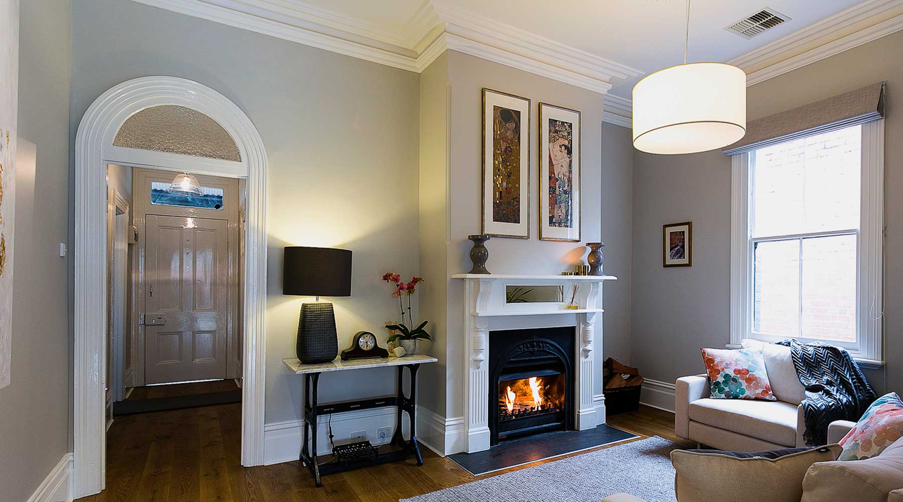 Living Room in Mitchell Street, Northcote with Gas ducted heating with add on air conditioning, Ceiling vents, Real flame gas fireplace