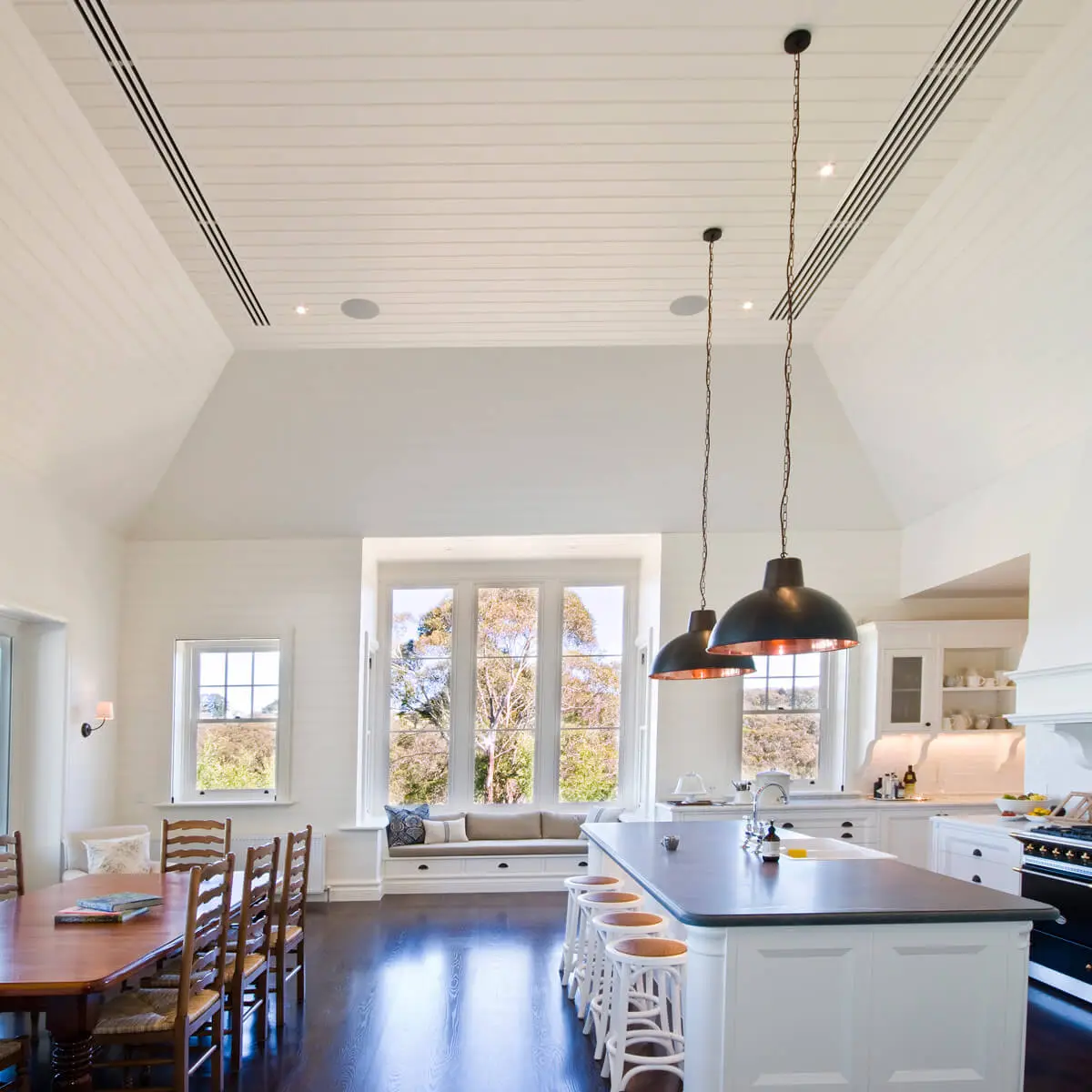 Kitchen with ceiling vents supplied by a serviced ducted air conditioning system