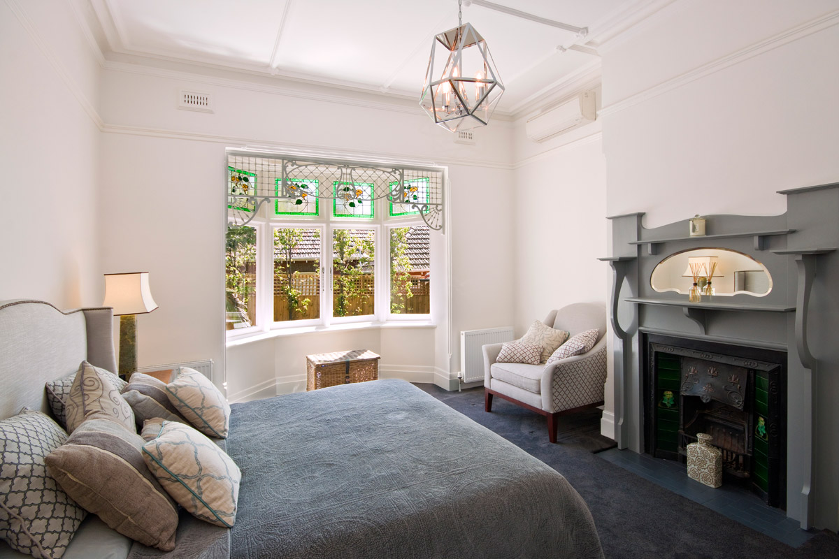 Main bedroom with a ceiling outlet served by gas ducted heating