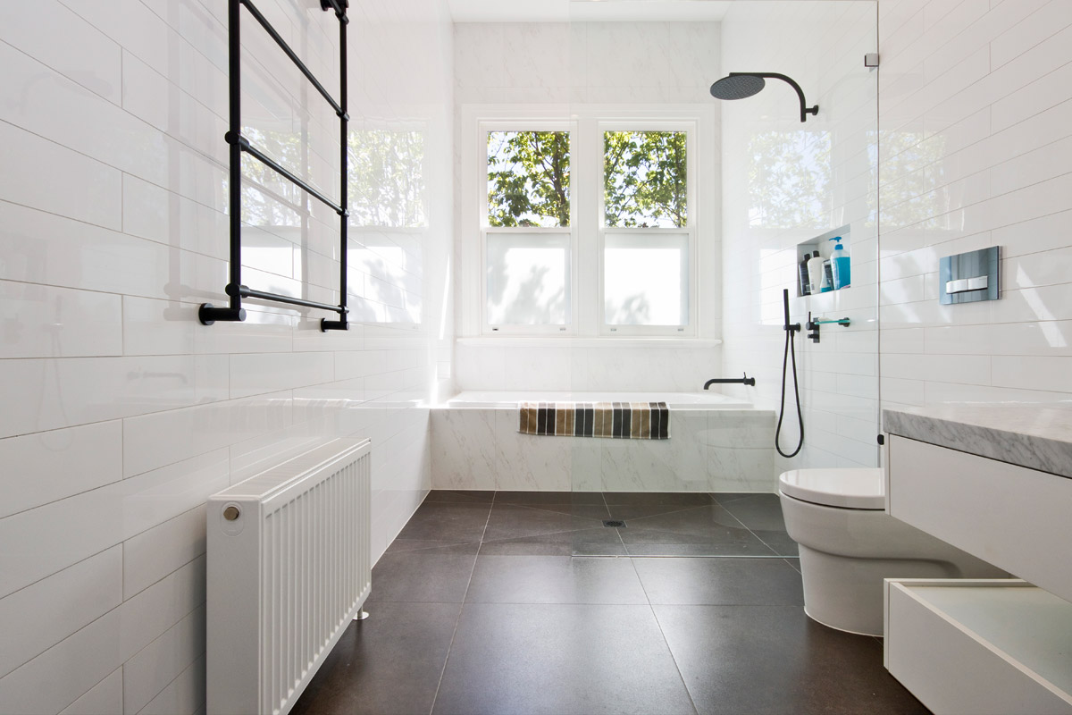Bathroom with a Delonghi heated towel rail